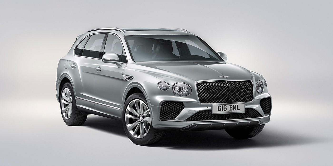 Bentley Santo Domingo Bentley Bentayga in Moonbeam paint, front three-quarter view, featuring a matrix grille and elliptical LED headlights.