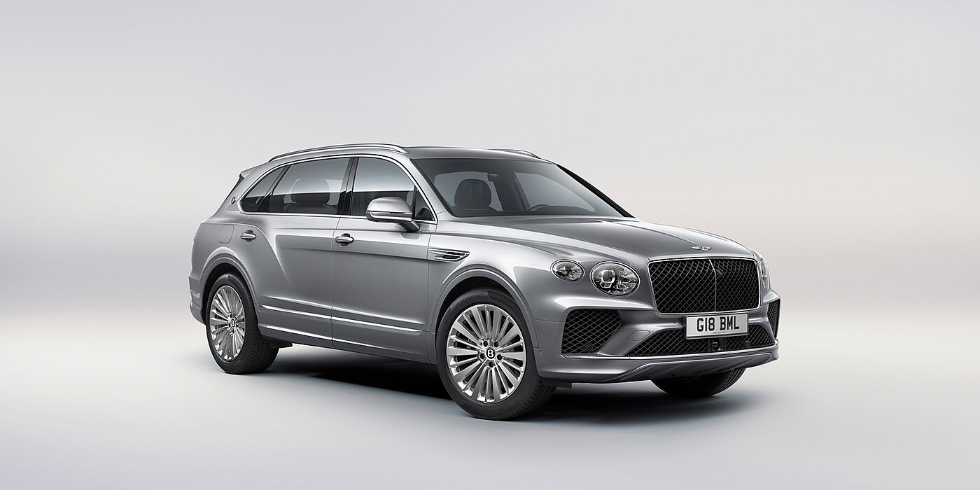 Bentley Santo Domingo Bentley Bentayga Extended Wheelbase luxury SUV front three quarter view in Moonbeam paint with 21 inch five spoke painted wheels