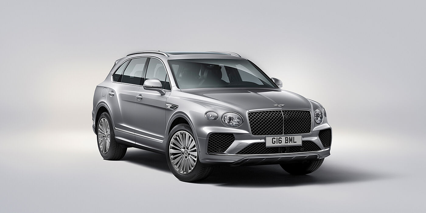 Bentley Santo Domingo Bentley Bentayga luxury SUV front three quarter view in Moonbeam paint with matrix grille and 21″ 5 spoke painted wheels