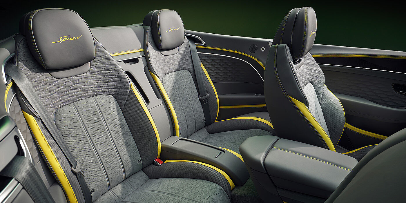 Bentley Santo Domingo Bentley New Continental GTC Speed convertible rear interior with unique Speed colour split in Gravity Grey and Cyber Yellow hide colours, and contrast stitched headrest emblems 