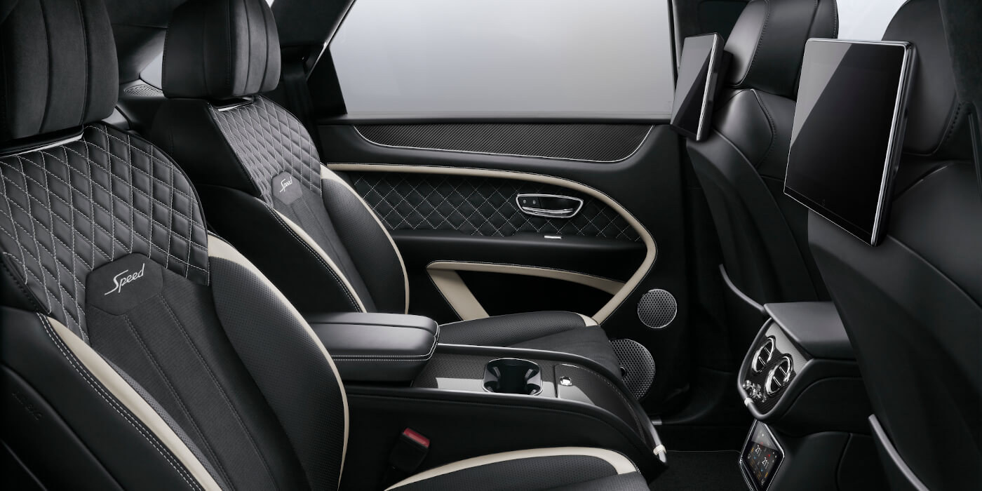 Bentley Santo Domingo Bentley Bentayga Speed SUV rear interior in Beluga black and Linen hide with carbon fibre veneer