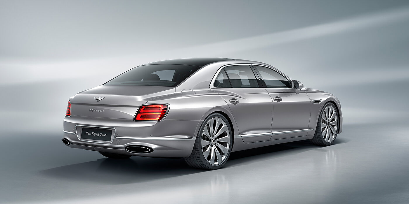 Bentley Santo Domingo New Bentley Flying Spur sedan rear view in Silverlake paint with ten spoke wheels and chrome matrix grille