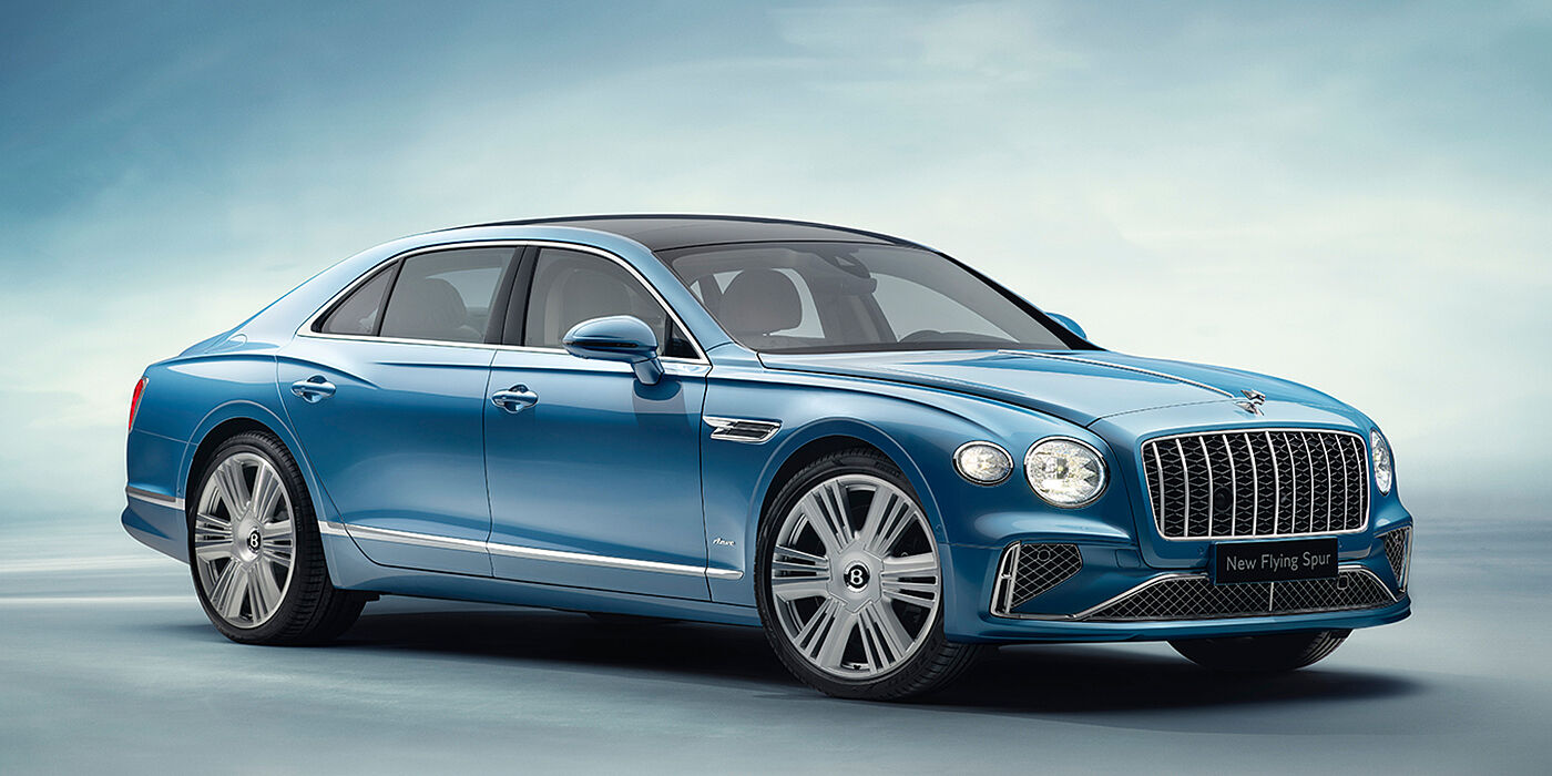 Bentley Santo Domingo New Bentley Flying Spur Azure sedan front view in Light windsor blue by Mulliner paint with 22 inch Azure wheels and chrome exterior details