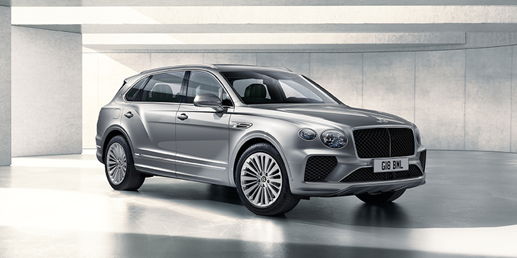 Bentley Santo Domingo Bentley Bentayga Extended Wheelbase SUV front three quarter in Moonbeam paint with a grey background