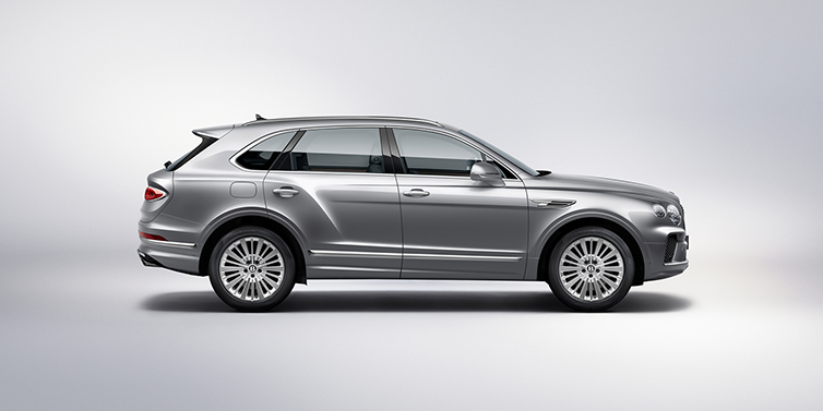 Bentley Santo Domingo Bentley Bentayga SUV side profile in Moonbeam silver paint against white background featuring 21 inch 5 spoke wheels